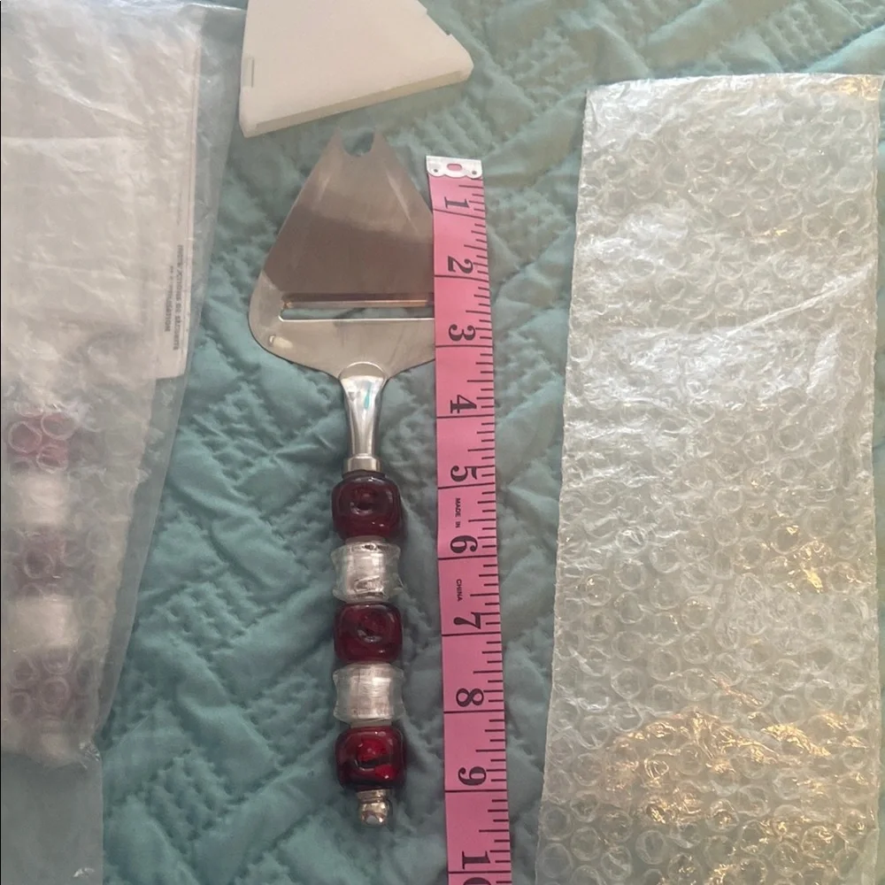 The Pampered Chef Red and Silver Cake Server